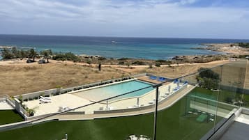 Outdoor pool, pool umbrellas, pool loungers