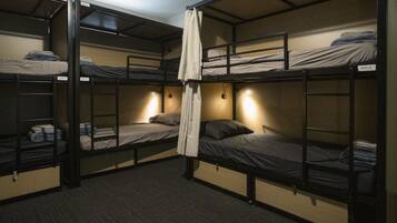 A bunk bed room with multiple beds, each labeled with a mix number.