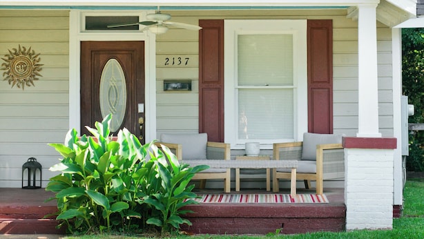 A single-story house with a front porch, a mailbox, and a number '2137' on the door.