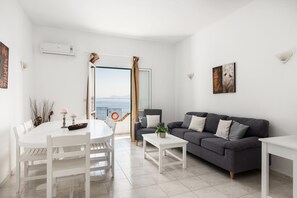 Villa | Living area | 32-inch flat-screen TV with satellite channels, DVD player - Four-Bedroom Villa Eleni by Konnect, with Private Pool & Stunning Seaview (Corfu)