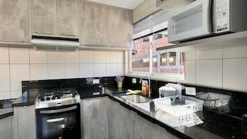 Apartment | Private kitchen | Fridge, microwave, oven, stovetop