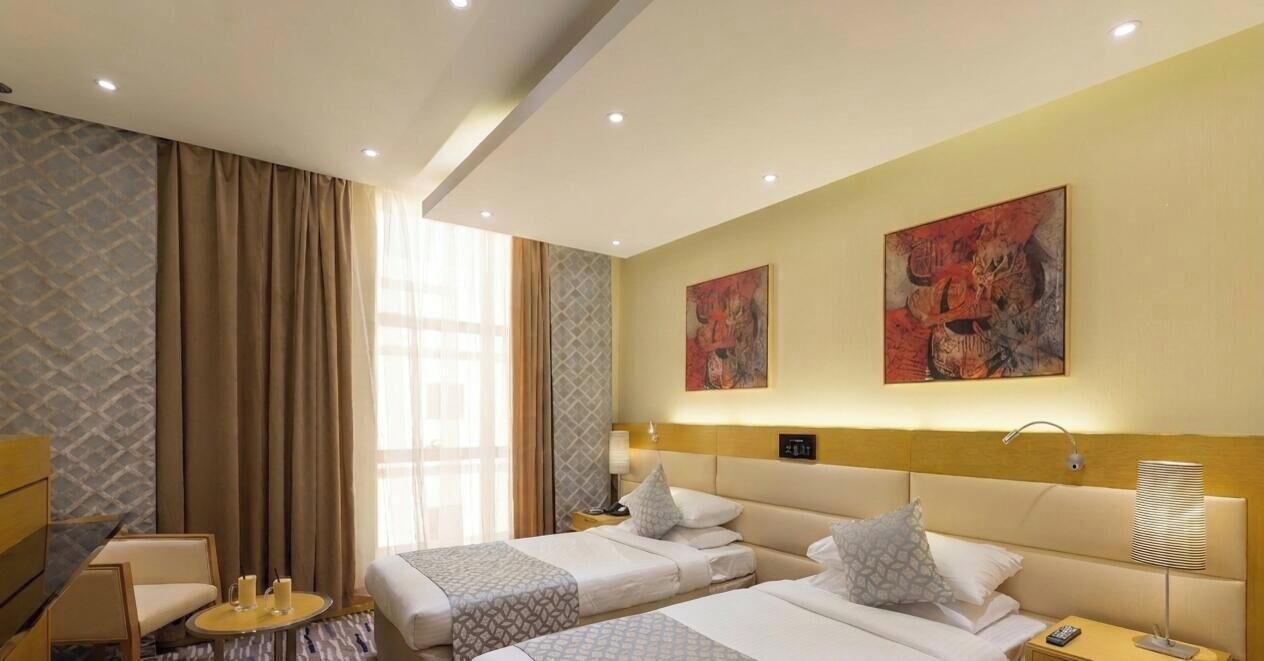 Deluxe Twin Room | Minibar, in-room safe, blackout curtains