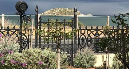 Beachfront romantic Greek Isle vibe rare historic cottage breathtaking sunrises