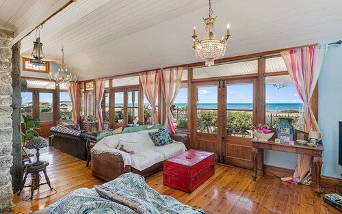 Beachfront romantic Greek Isle vibe rare  historic cottage breathtaking sunrises