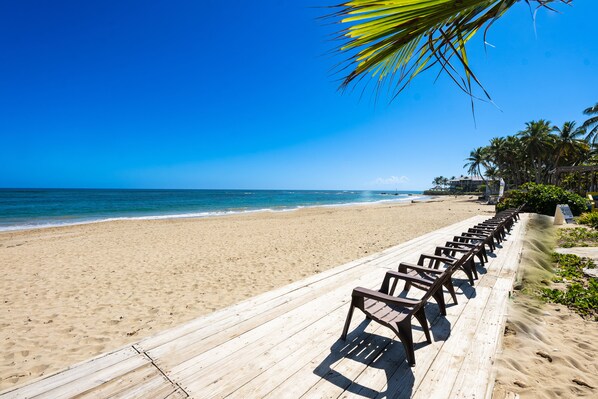 On the beach, sun loungers, beach towels - KiteBeach Oceanfront Groundfloor Studio (Cabarete)
