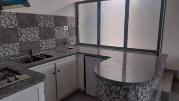 Fridge, stovetop, coffee/tea maker, cookware/dishes/utensils