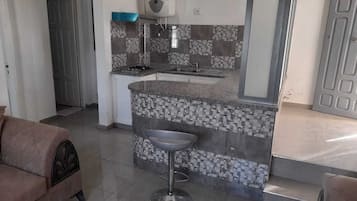 Fridge, stovetop, coffee/tea maker, cookware/dishes/utensils