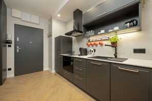 Private kitchen - Black and Beige Apartment by Renters (Wroclaw)