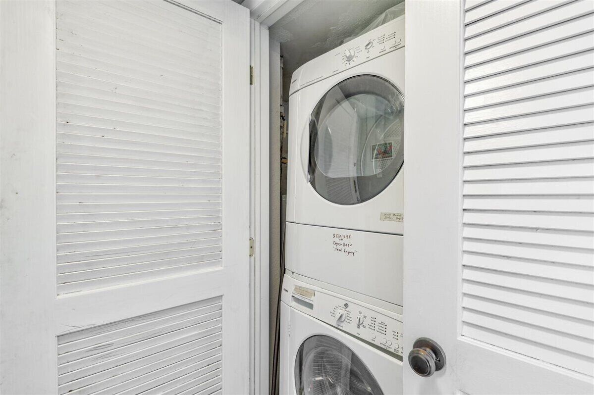 A laundry room with a front-loading washing machine and dryer.