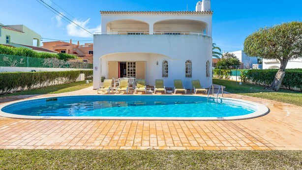 A two-story building with a swimming pool in front. - Villa Noras - Three Bedroom Villa, Sleeps 6 (Albufeira)