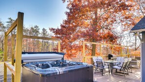 A hot tub on a wooden deck with outdoor furniture and a pergola. - Serene Springfield Retreat on 6 Acres w/ Hot Tub! (Springfield)