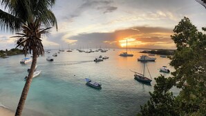 A marina with various boats docked at sunset. - Hostal Magallanes Bayahibe (San Rafael del Yuma)