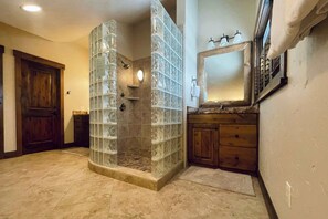 Shower, hair dryer, towels, shampoo
