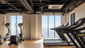 A gym with treadmills, stationary bikes, and elliptical machines. - Croydon by Charles Hope (Croydon)