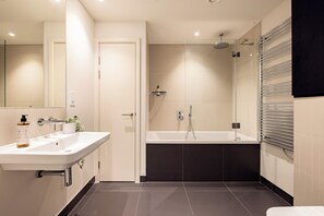 Superior One Bedroom Apartment | Bathroom | Rainfall showerhead, hair dryer, towels, toilet paper