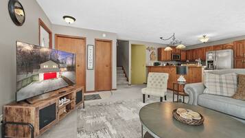 Smart TV, fireplace, table football, books