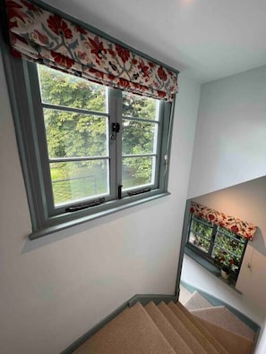 A staircase with a window at the top.