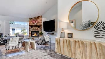 Smart TV, fireplace, table football, books