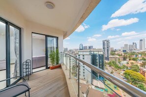 Enjoy the city view from this balcony with a clear view of the surrounding buildings.