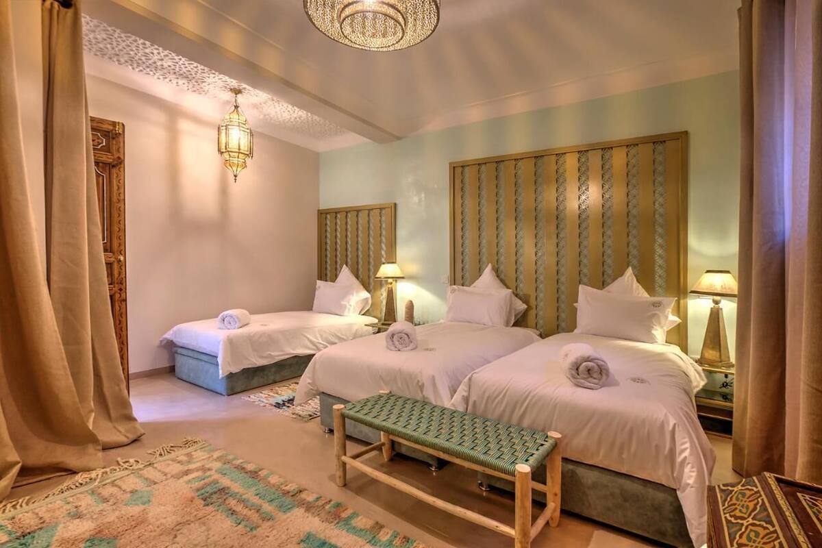 Chambre triple | Coffre-fort, accès au Wi-Fi (inclus)