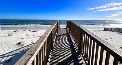 Beach-view cottage near beach with pool, wrap-around balcony, boat dock, W/D, AC