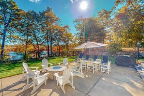 Outdoor dining - Sprawling dog-friendly lake estate with pool, patio, fire pit, games, & views (Barnstable)