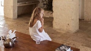 A rustic interior with a stone fireplace, a wooden table, and a white chair. - Masseria Angiulli Piccolo w pool / Salento Apulia (Grottaglie)