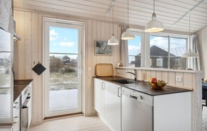 Fridge, stovetop, dishwasher, coffee/tea maker