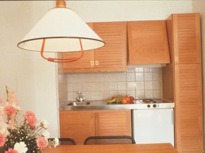 Fridge, microwave, coffee/tea maker, cookware/dishes/utensils