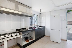 Fridge, stovetop, highchair, cookware/dishes/utensils