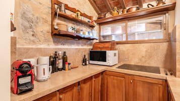 Fridge, microwave, stovetop, coffee/tea maker