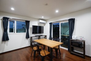 Deluxe Villa | Living area | 55-inch LCD TV with digital channels