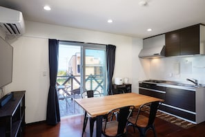 Deluxe Villa | Living area | 55-inch LCD TV with digital channels