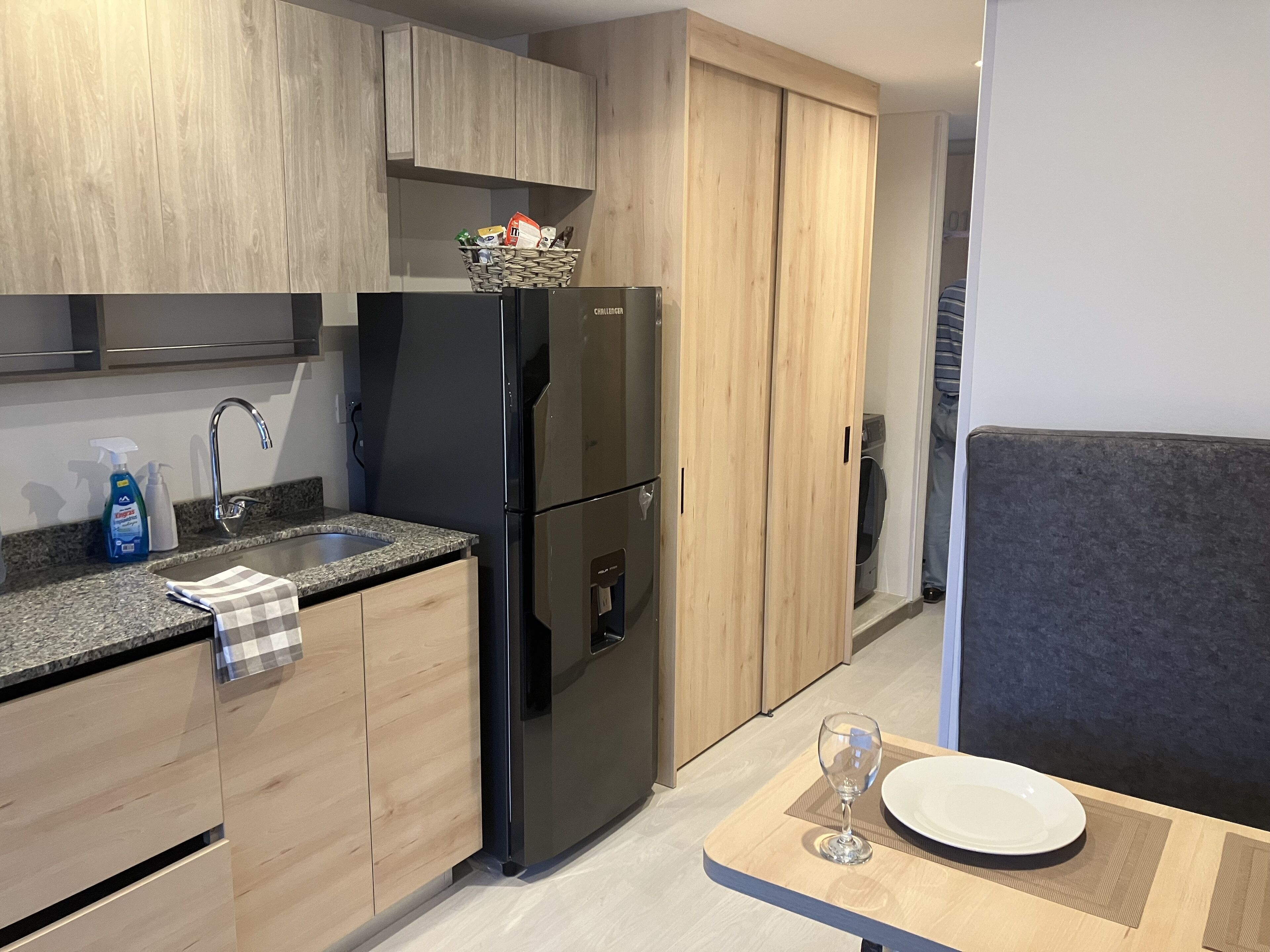 Fridge, microwave, coffee/tea maker, cookware/dishes/utensils