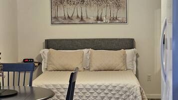 1 bedroom, desk, iron/ironing board, travel crib