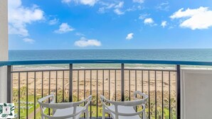 A balcony with a view of the beach and ocean. - Direct Oceanfront Two Bedroom Condo (Myrtle Beach)