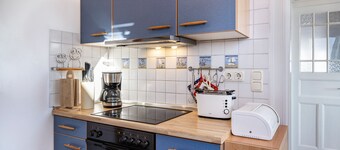 Appartamento 'Haus Übersee Wohnung Sansibar' con giardino in comune e Wi-Fi