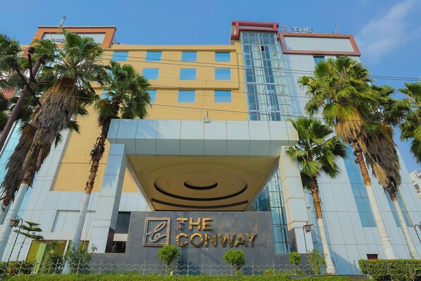 A modern hotel with a prominent sign reading "The Conway." - The Conway (Meerut)