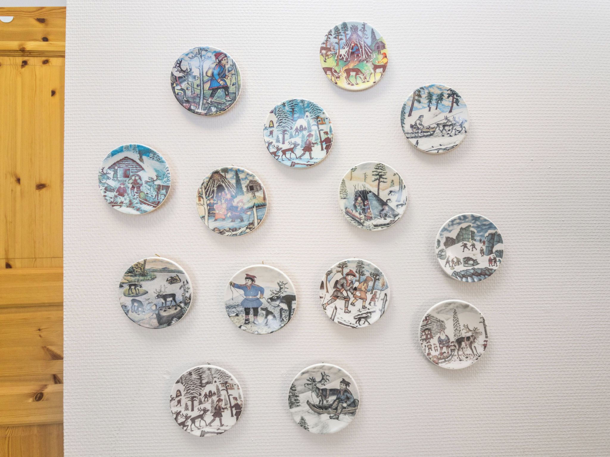 A collection of circular decorative plates with various historical and cultural scenes.
