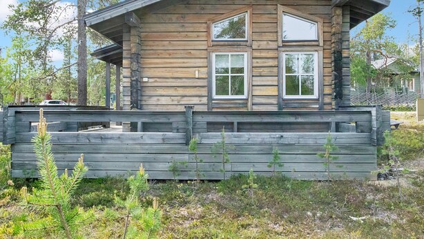 A log cabin with a gabled roof, two windows, and a stone foundation. - Pikku-veke by Interhome (Inari)