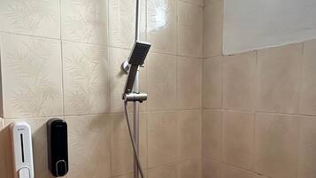 Shower, rainfall showerhead, hair dryer, towels