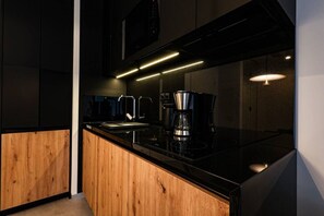 Fridge, microwave, stovetop, coffee/tea maker