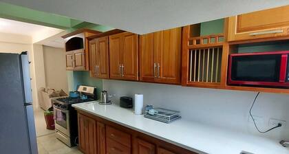 Cosy apartment on Merchant Man Ave Crown Point Tobago. near beaches- night life