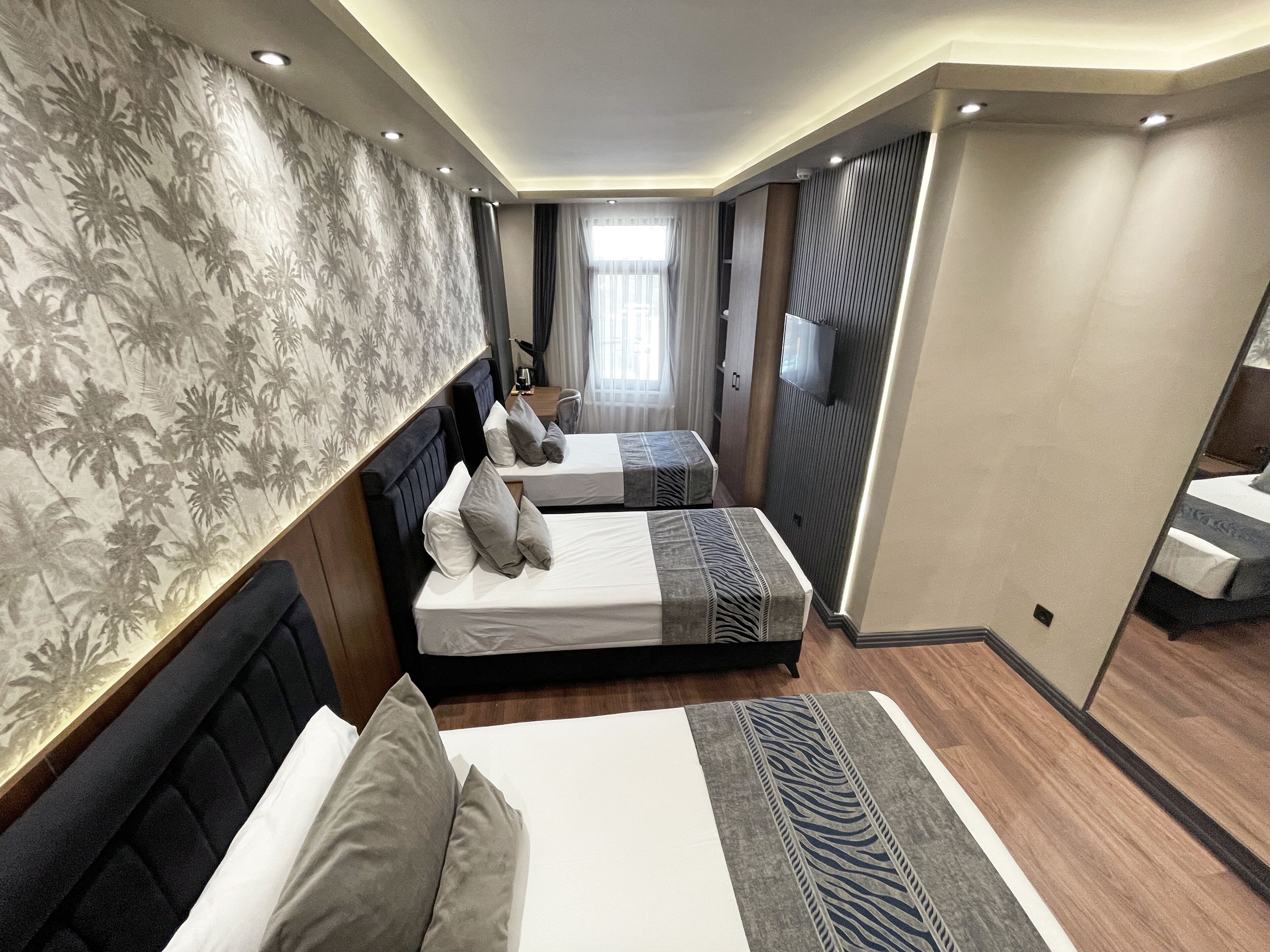 Chambre Triple Standard | Minibar, bureau, espace de travail pour ordinateur portable