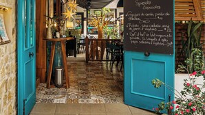 An interior view of a restaurant named 'CITRUS' with a chalkboard menu listing specials. - Cute. Cozy. Private. Pool. Ojochal. (Ojochal)