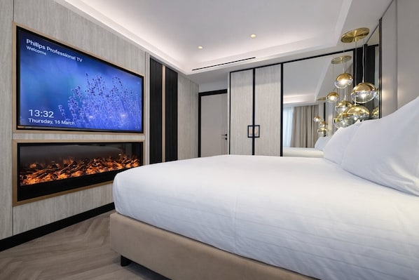 Suite de lujo | Ropa de cama de alta calidad, edredón y minibar