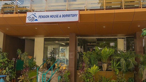 A building with a sign for a pension house and dormitory. - Goland Pension House and Dormitory by SMS Hospitality (Cebu City)