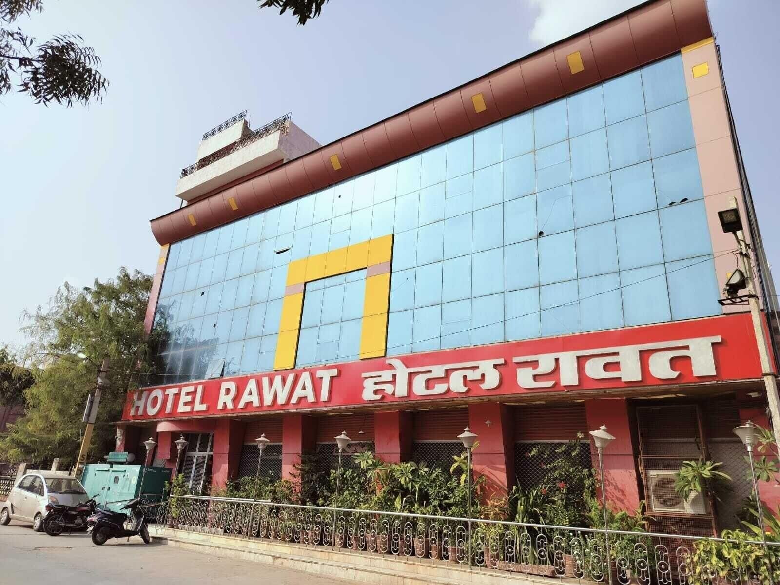 A hotel building with a large glass facade and a prominent number 7 sign.