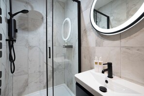 Shower, hair dryer, towels