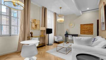 Comfort Penthouse, 1 Bedroom | Living area | 100-cm flat-screen TV with cable channels, TV